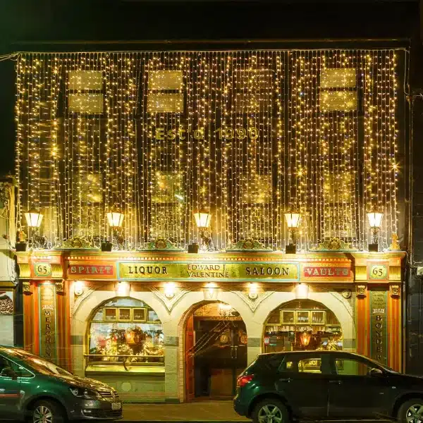 LED curtain lights 10m drop in warm white with ice white flash on a bar building