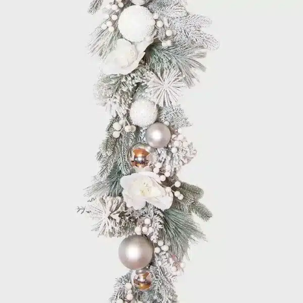 Mixed white bauble frosted Christmas garland close up