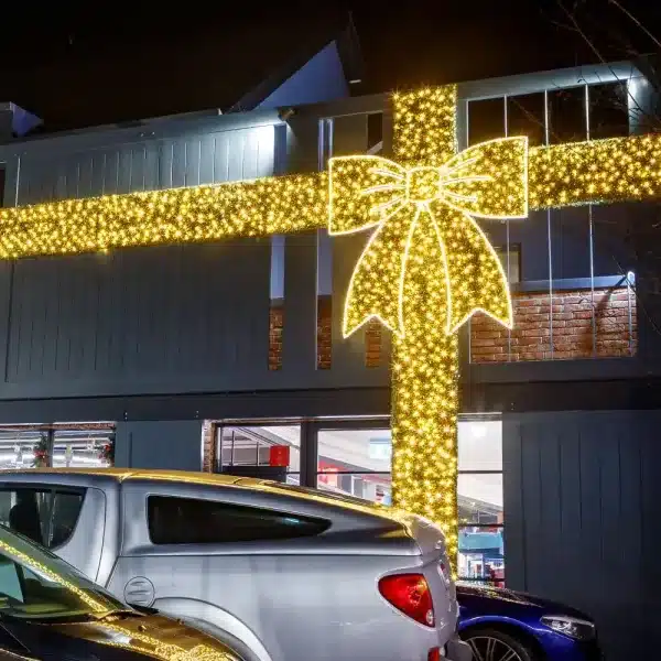 Giant gold bow 2D Christmas decoration Barnhill Stores project display