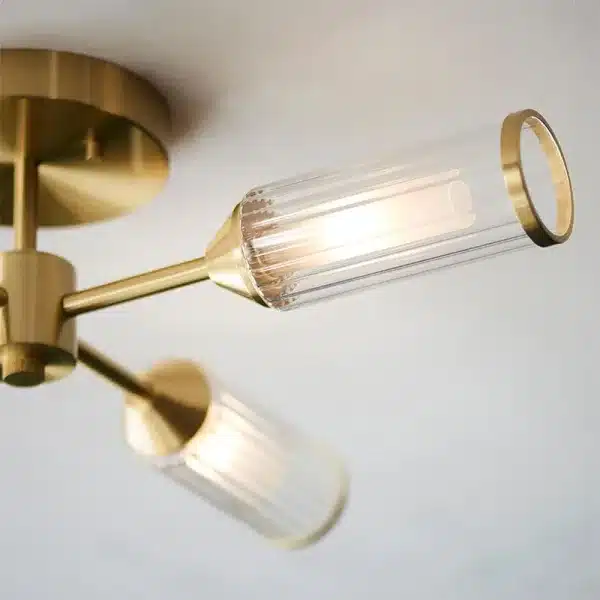 Satin brass semi flush ceiling light with ribbed glass shades side view